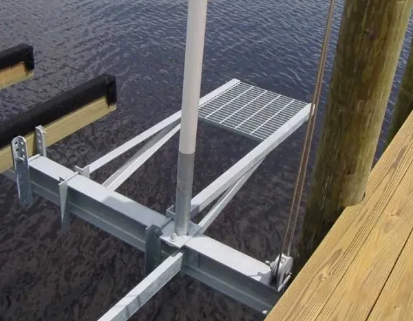 Aluminum grated platform attached to a boat lift for enhanced dockside access and safety.