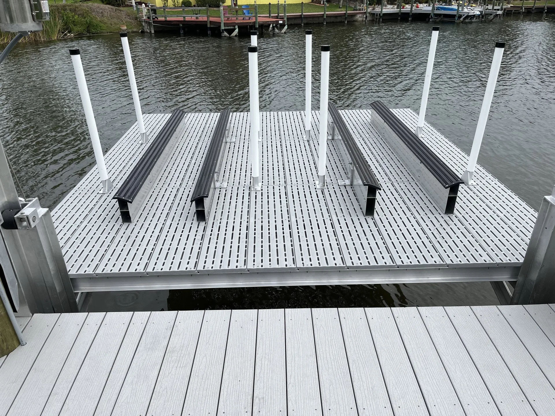 A custom boat lift platform with durable materials and adjustable supports over the water.